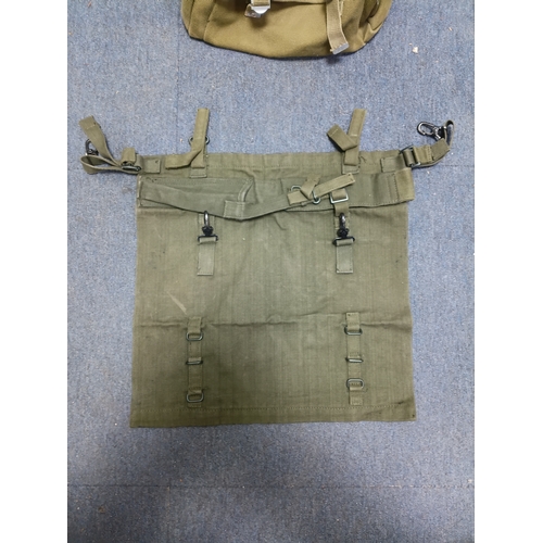 204 - A collection of 4 British army items which display the broadarrow. To include, a canvas heavy duty b... 