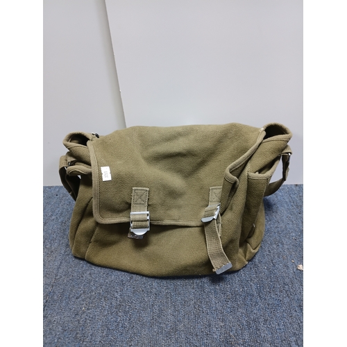 204 - A collection of 4 British army items which display the broadarrow. To include, a canvas heavy duty b... 