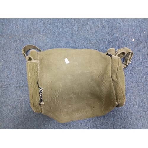 204 - A collection of 4 British army items which display the broadarrow. To include, a canvas heavy duty b... 