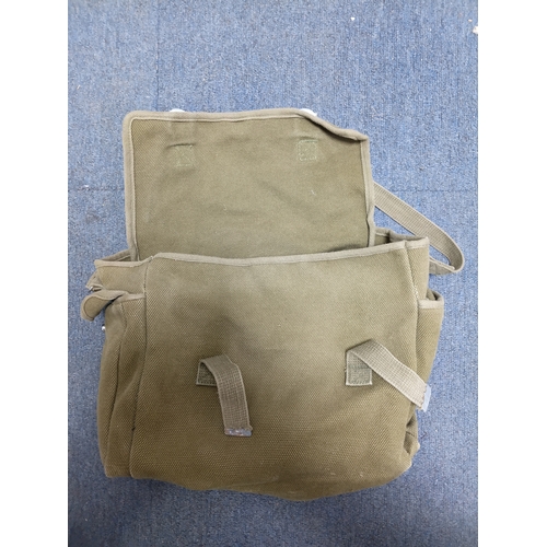 204 - A collection of 4 British army items which display the broadarrow. To include, a canvas heavy duty b... 