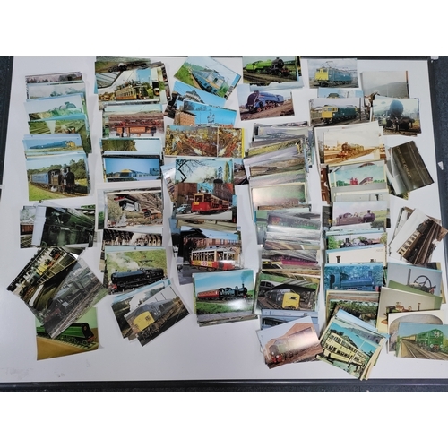 210 - A collection of post cards & photos of trains. Locations are at stations and museums