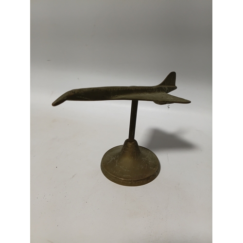 214 - A collection of brass and white metal model aeroplanes to include a spitfire, a concorde, a vulcan a... 