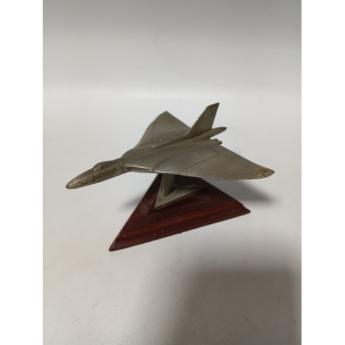 214 - A collection of brass and white metal model aeroplanes to include a spitfire, a concorde, a vulcan a... 