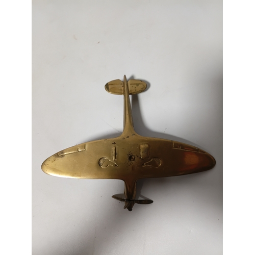 214 - A collection of brass and white metal model aeroplanes to include a spitfire, a concorde, a vulcan a... 