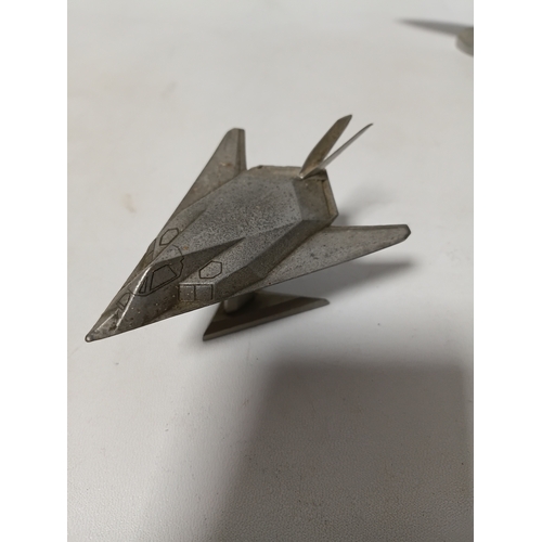 214 - A collection of brass and white metal model aeroplanes to include a spitfire, a concorde, a vulcan a... 