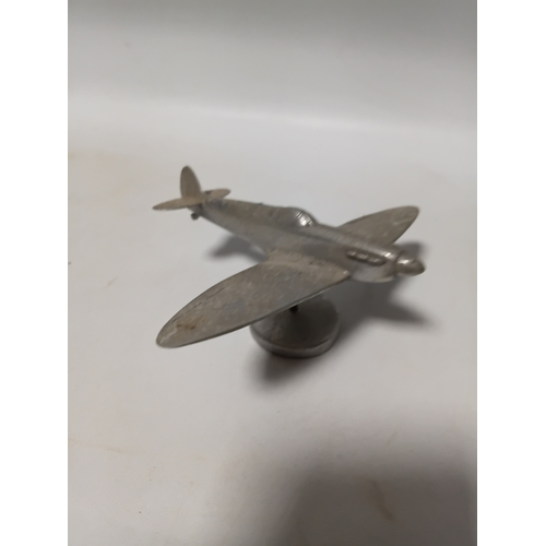 214 - A collection of brass and white metal model aeroplanes to include a spitfire, a concorde, a vulcan a... 