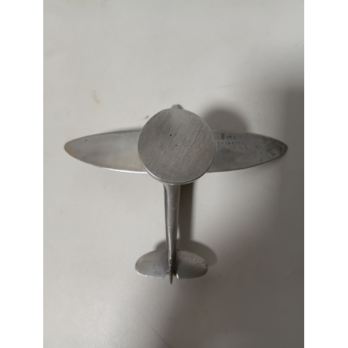 214 - A collection of brass and white metal model aeroplanes to include a spitfire, a concorde, a vulcan a... 