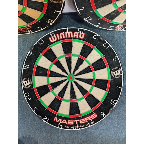 217 - Three dart boards to include Winmau diamond plus, winmau masters and unicorn eclipse Pro.