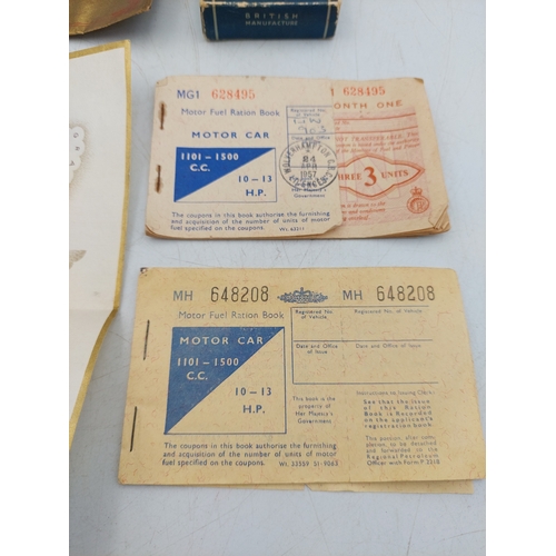 219 - A late 1930s Greetings telegram with 10 shilling note, together with two motor fuel ration books and... 