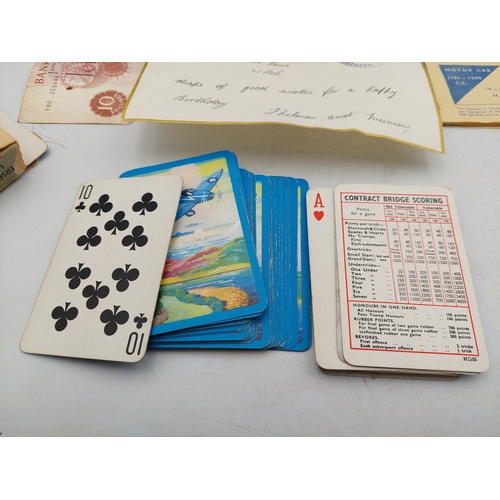 219 - A late 1930s Greetings telegram with 10 shilling note, together with two motor fuel ration books and... 