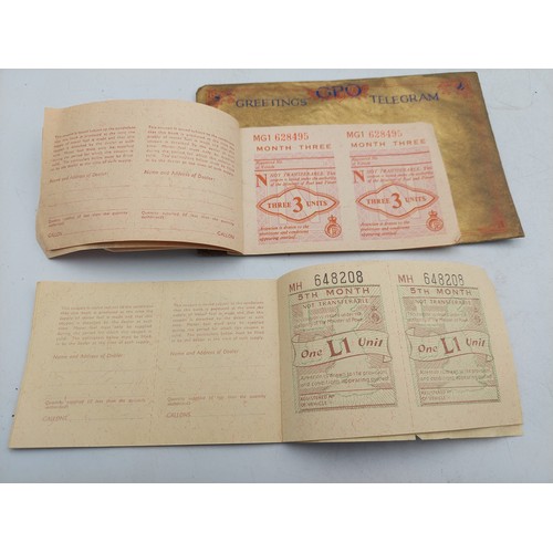 219 - A late 1930s Greetings telegram with 10 shilling note, together with two motor fuel ration books and... 