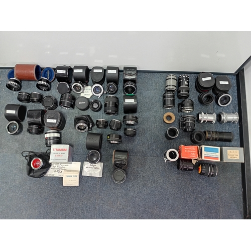 220 - A large collection of vintage photo lenses from the Vivitar, Soligor, Yashica and others.Extension t... 