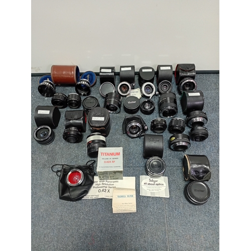 220 - A large collection of vintage photo lenses from the Vivitar, Soligor, Yashica and others.Extension t... 