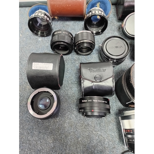 220 - A large collection of vintage photo lenses from the Vivitar, Soligor, Yashica and others.Extension t... 