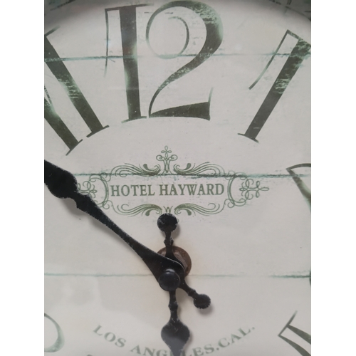 221 - A pair of pat tested and working angle poise style table lamps and a hotel Haywards clock, the large... 