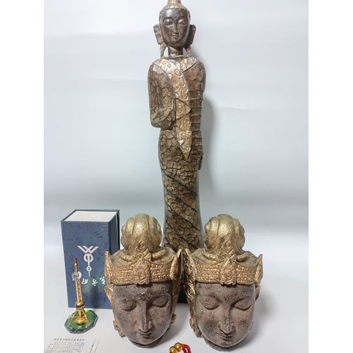285 - A tall, hand-carved wooden standing Buddha statue, 2 Buddha heads, 2 red Chinese New Year tassel orn... 
