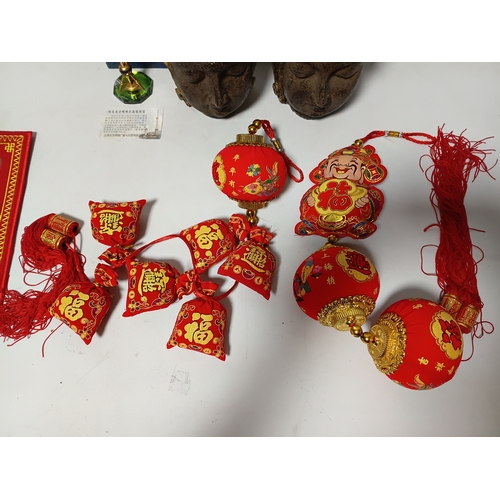 285 - A tall, hand-carved wooden standing Buddha statue, 2 Buddha heads, 2 red Chinese New Year tassel orn... 