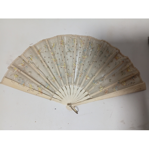 290 - A collection of fans all different size and styles.