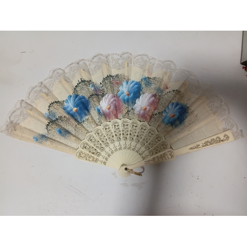 290 - A collection of fans all different size and styles.