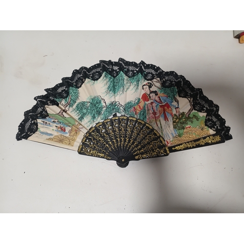 290 - A collection of fans all different size and styles.