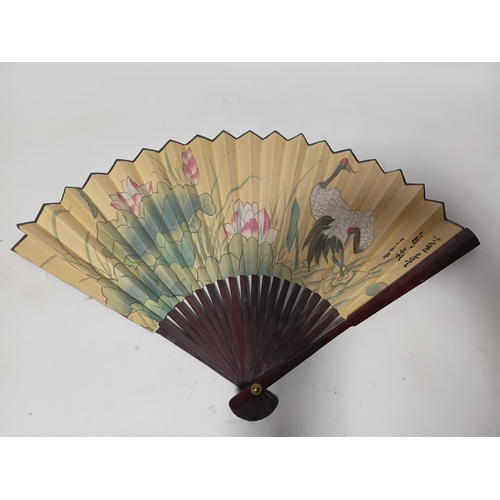 290 - A collection of fans all different size and styles.