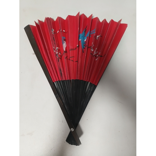 290 - A collection of fans all different size and styles.