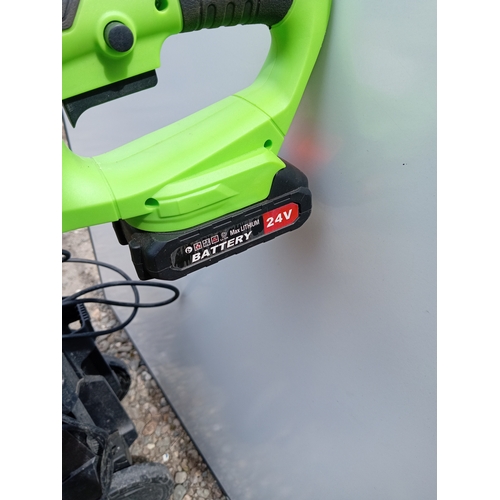 195 - A working electric one handed lawn mower & a Archer K4 compact jet wash from a house clearance, unte... 