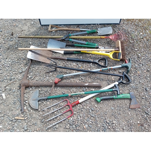 199 - A collection of garden tools. To include shovels, rake, pickaxe, etc...