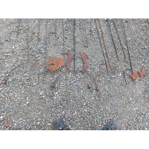 175 - A collection of rustic metal garden decorations.
