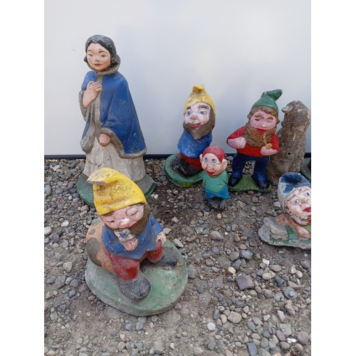 176 - A collection of 9 garden gnomes.