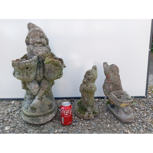 182 - A trio of garden gnomes statues.