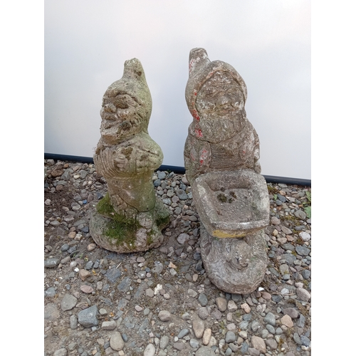 182 - A trio of garden gnomes statues.