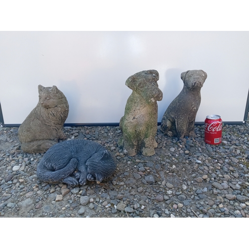 184 - A collection of 4 dogs & cats garden statue.