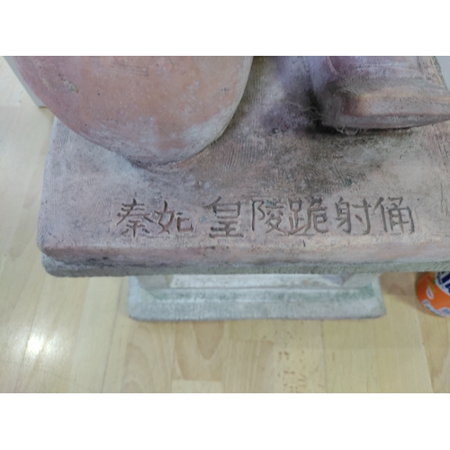 190 - A very large and heavy kneeling terracotta soldier on a plinth. ( Height 102 cm x Width 35 cm x Dept... 