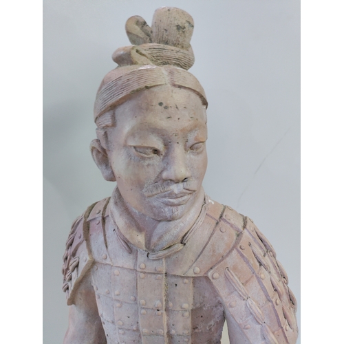 190 - A very large and heavy kneeling terracotta soldier on a plinth. ( Height 102 cm x Width 35 cm x Dept... 