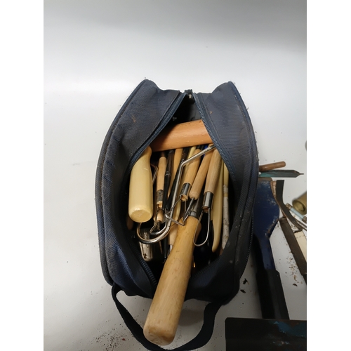 171 - A collection of hand tools. To include, hammers, carpenter scribs, an oil can and more.