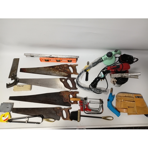 172 - A collection of tools to include, hand saws, levels, a sander, a spray gun and more.