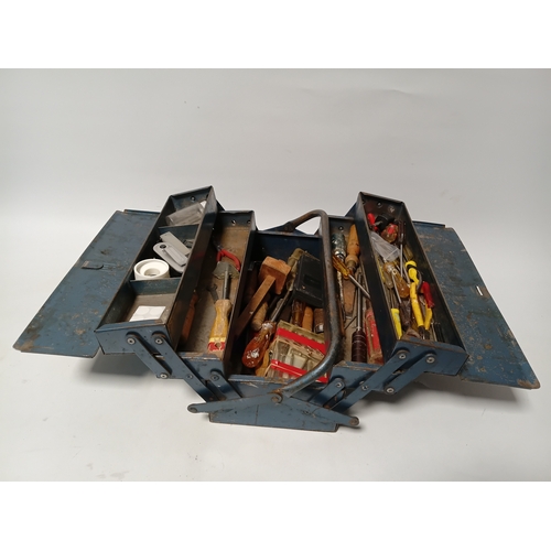 174 - A vintage blue metal cantilever toolbox full of tools such as, pliers, screwdrivers, a scraper and m... 