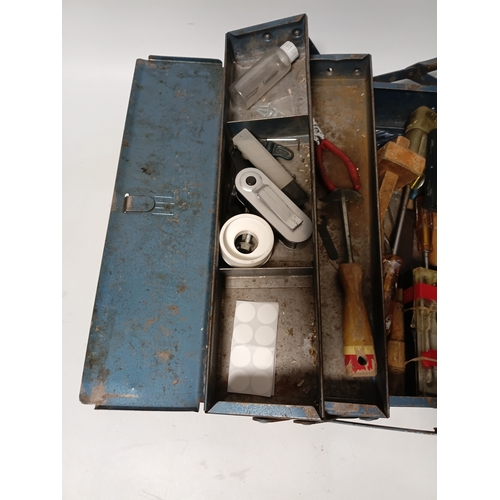 174 - A vintage blue metal cantilever toolbox full of tools such as, pliers, screwdrivers, a scraper and m... 