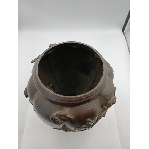 294 - A vintage oriental bronze vase with intricate raised depictions of birds and foliage. Height 10 1/2 ... 
