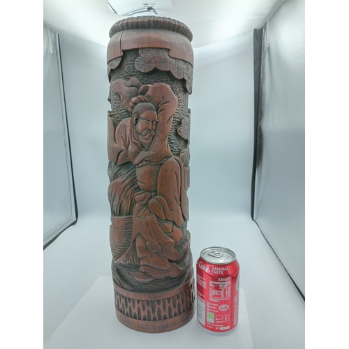 295 - An antique Chinese decorative hand carved bamboo brush pot. Height 18 inches x diameter 5 inches