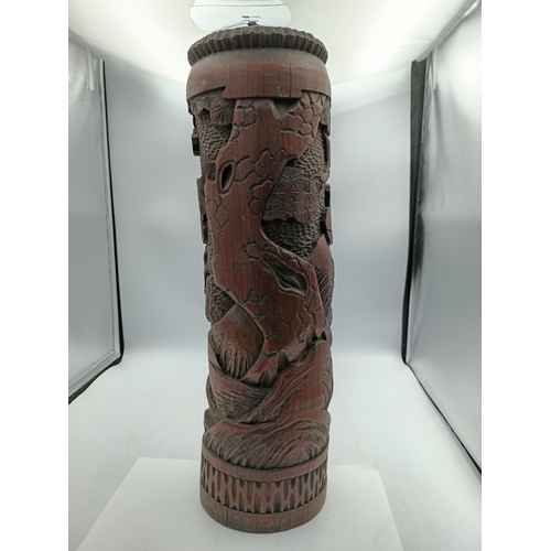 295 - An antique Chinese decorative hand carved bamboo brush pot. Height 18 inches x diameter 5 inches