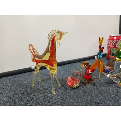 296 - A collection of glass items. To include, a hand blown vase, a Murano style vase and small glass figu... 