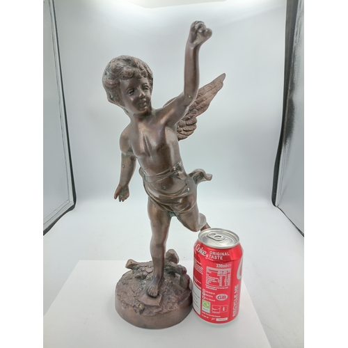 297 - A bronze Cherub statue with wings on a decorative stand. Height 13 inches x Width 6 inches