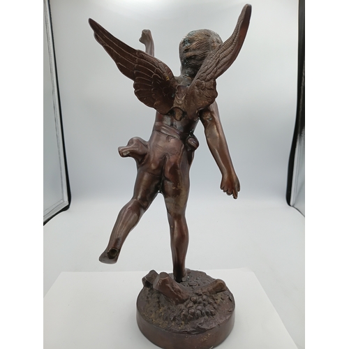 297 - A bronze Cherub statue with wings on a decorative stand. Height 13 inches x Width 6 inches
