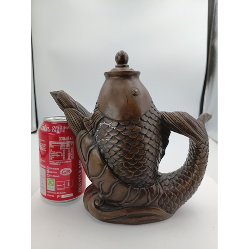 298 - A vintage Chinese bronze tea pot depicting a lucky fish. Height 8 inches x Width 9 inches