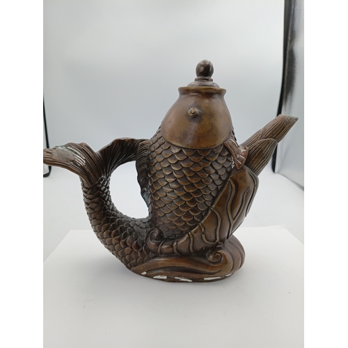 298 - A vintage Chinese bronze tea pot depicting a lucky fish. Height 8 inches x Width 9 inches
