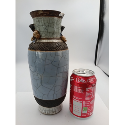 299 - A vintage Chinese crackle glazed vase with a celadon-blue glaze and decorative brown bands. Slight d... 