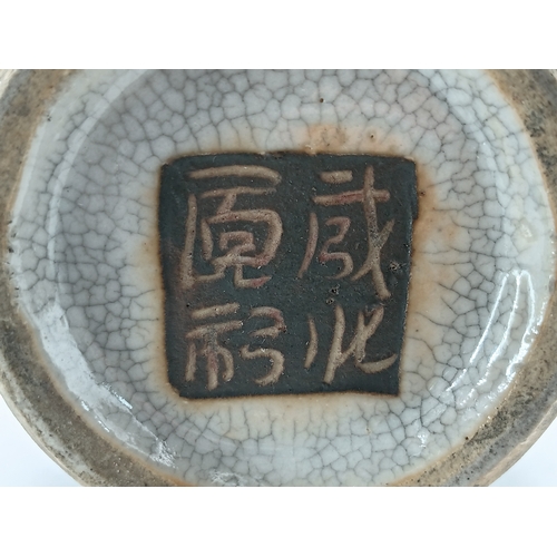 299 - A vintage Chinese crackle glazed vase with a celadon-blue glaze and decorative brown bands. Slight d... 