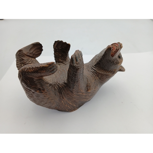 301 - A hand carved black forest bear from the Swiss or German regions of the black forest. Height 3 inche... 
